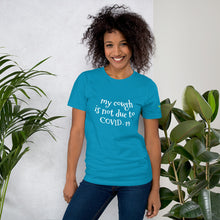 Load image into Gallery viewer, Woman in Turquoise T-shirt with My Cough is not due to COVID-19 on the front and 333 Explosion logo on left sleeve also available t-shirts colors blue, true royal, dark grey heather, berry, heather forest, autumn, aqua, heather orchid