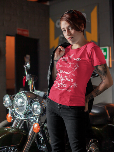 woman leaning up on motorcycle wearing a red t-shirt that says Since I'm not basic nor should my Christimas gift be. T-shirt also available in leaf green