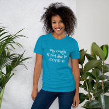 Load image into Gallery viewer, Woman in Turquoise T-shirt with My Cough is not due to COVID-19 on the front and 333 Explosion logo on left sleeve also available t-shirts colors blue, true royal, dark grey heather, berry, heather forest, autumn, aqua, heather orchid
